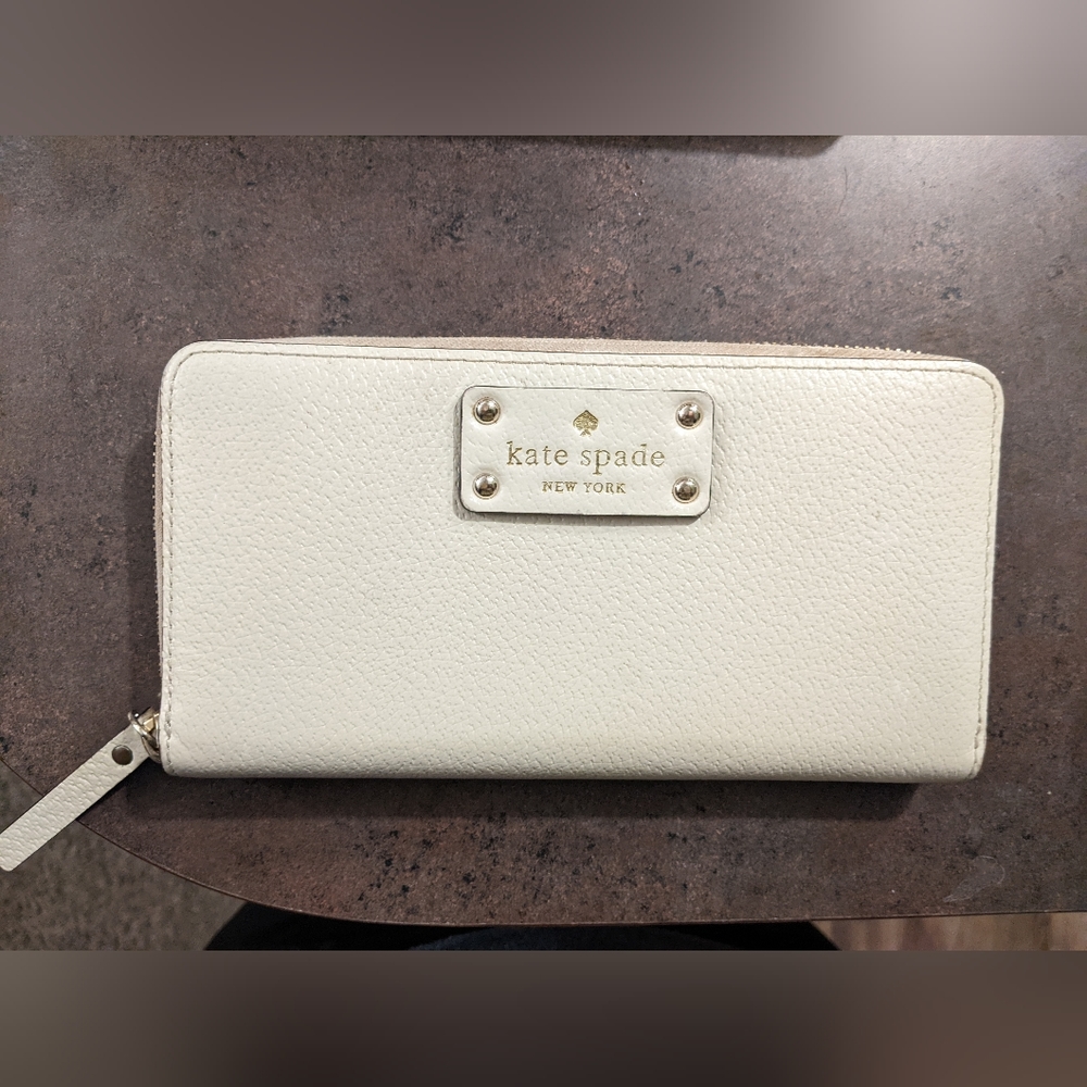 Kate Spade cream zip-around wallet